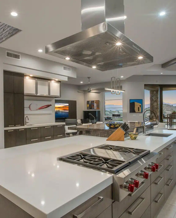 White shaker cabinetry and a stone island in a finished Scottsdale kitchen