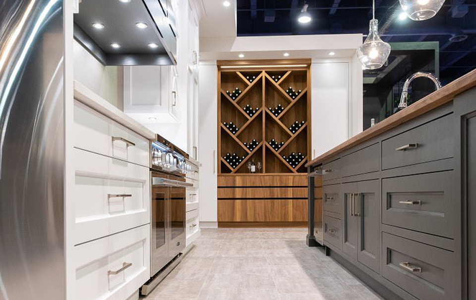 Full-height cabinetry running to the ceiling in a high-ceiling kitchen